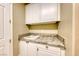 Laundry room with a sink and granite countertop at 2 Cerchio Centrale, Henderson, NV 89011