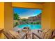 Relaxing view of pool, patio, and fire pit from covered seating at 2 Cerchio Centrale, Henderson, NV 89011