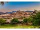 Community view of homes and mountains in a golf course community at 2 Cerchio Centrale, Henderson, NV 89011