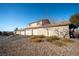 Two-car garage and desert landscaping at 2050 N Los Feliz St # 172, Las Vegas, NV 89156