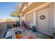 Inviting patio with colorful rug, wrought iron furniture, and bench at 2050 N Los Feliz St # 172, Las Vegas, NV 89156