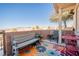 Private patio with seating area and mountain views at 2050 N Los Feliz St # 172, Las Vegas, NV 89156