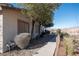 Landscaped side yard with walkway at 2050 N Los Feliz St # 172, Las Vegas, NV 89156