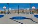 Outdoor basketball court with multiple hoops and seating at 2077 Via Firenze, Henderson, NV 89044