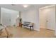 Light and airy entryway with a bench and wood floors at 2077 Via Firenze, Henderson, NV 89044