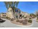 Tan townhome with landscaped yard and patio at 2077 Via Firenze, Henderson, NV 89044