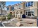 Small front patio with seating area, in front of a townhome at 2077 Via Firenze, Henderson, NV 89044