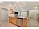 Modern kitchen with island seating and stainless steel appliances at 2077 Via Firenze, Henderson, NV 89044