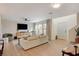 Living room with light wood floors, neutral decor, and a view of the outdoors at 2077 Via Firenze, Henderson, NV 89044