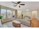 Spacious living room featuring a sectional sofa and lots of natural light at 2077 Via Firenze, Henderson, NV 89044