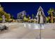 Night view of resort-style pool with lounge chairs at 222 Karen Ave # 2308, Las Vegas, NV 89109