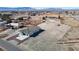 Expansive desert property featuring new home with two car garage and desert landscaping at 2560 Tahachapi Ave, Pahrump, NV 89048