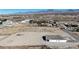 Aerial view of a new home with large lot in the desert landscape with mountain views at 2560 Tahachapi Ave, Pahrump, NV 89048