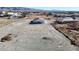 Aerial view of a house with a large lot in a desert landscape, distant mountains in background at 2560 Tahachapi Ave, Pahrump, NV 89048