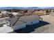 A birds eye view shows the brand new house, desert landscaping, and mountain views at 2560 Tahachapi Ave, Pahrump, NV 89048