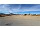 Aerial view of a large lot with a gravel driveway and desert landscape at 2560 Tahachapi Ave, Pahrump, NV 89048