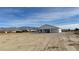 Newly built home with a large backyard and covered patio, offering mountain views at 2560 Tahachapi Ave, Pahrump, NV 89048