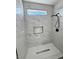 Shower featuring updated tile surround and black hardware at 2560 Tahachapi Ave, Pahrump, NV 89048