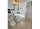 Bathroom featuring a vanity with modern fixtures, a mirror, and a toilet, showcasing a functional layout at 2560 Tahachapi Ave, Pahrump, NV 89048