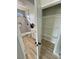 Modern bathroom connected to a walk-in closet, featuring a tiled shower, vanity, and practical storage at 2560 Tahachapi Ave, Pahrump, NV 89048