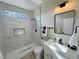 Modern bathroom with walk-in shower and white vanity at 2560 Tahachapi Ave, Pahrump, NV 89048