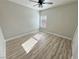 Sunny bedroom with hardwood floors and ceiling fan at 2560 Tahachapi Ave, Pahrump, NV 89048