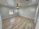 Spacious bedroom with a ceiling fan and natural light at 2560 Tahachapi Ave, Pahrump, NV 89048
