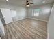 Spacious bedroom with wood-look floors and large window at 2560 Tahachapi Ave, Pahrump, NV 89048