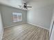 Spacious bedroom with ceiling fan and hardwood floors at 2560 Tahachapi Ave, Pahrump, NV 89048