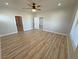 Spacious bedroom featuring modern ceiling fan and hardwood floors at 2560 Tahachapi Ave, Pahrump, NV 89048