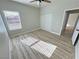 Bright bedroom features a ceiling fan, closet, and plank flooring at 2560 Tahachapi Ave, Pahrump, NV 89048