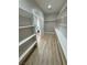 Walk-in closet with built-in shelving and access to bathroom at 2560 Tahachapi Ave, Pahrump, NV 89048