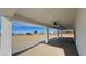 Spacious covered patio with ceiling fans, offering views of the surrounding landscape at 2560 Tahachapi Ave, Pahrump, NV 89048