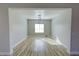 Bright dining room with wood-look floors and view to kitchen at 2560 Tahachapi Ave, Pahrump, NV 89048