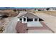 Charming new construction home with a spacious driveway and well manicured landscaping at 2560 Tahachapi Ave, Pahrump, NV 89048