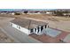 Beautiful new home featuring desert landscaping, spacious driveway and attached two car garage at 2560 Tahachapi Ave, Pahrump, NV 89048