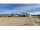 A rear view of this lovely property, perfect for enjoying the expansive outdoor space at 2560 Tahachapi Ave, Pahrump, NV 89048