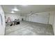 Large two-car garage with high ceilings and epoxy flooring at 2560 Tahachapi Ave, Pahrump, NV 89048