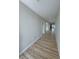 Inviting hallway with wood-look flooring, neutral walls, and recessed lighting, showcasing modern design at 2560 Tahachapi Ave, Pahrump, NV 89048