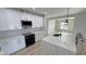 Beautiful kitchen features quartz countertops, modern lighting, and stainless steel appliances at 2560 Tahachapi Ave, Pahrump, NV 89048