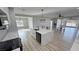 Gourmet kitchen with island seating opens to the dining and living areas at 2560 Tahachapi Ave, Pahrump, NV 89048