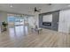 Open concept living room features modern fireplace, ceiling fan, and plenty of natural light at 2560 Tahachapi Ave, Pahrump, NV 89048