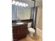 Bathroom with dark vanity, large mirror, and bathtub at 260 E Flamingo Rd # 433, Las Vegas, NV 89169