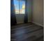 Bedroom with grey laminate flooring and view of High Roller at 260 E Flamingo Rd # 433, Las Vegas, NV 89169