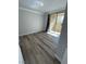 Bright bedroom with wood-look flooring and access to balcony at 260 E Flamingo Rd # 433, Las Vegas, NV 89169