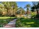 Lush community grounds featuring manicured lawns, a walkway, trees, and a pool at 260 E Flamingo Rd # 433, Las Vegas, NV 89169