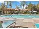 Community pool and deck with lounge chairs and palm trees at 260 E Flamingo Rd # 433, Las Vegas, NV 89169