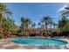 Beautiful pool with ample seating and palm trees on a clear sunny day at 260 E Flamingo Rd # 433, Las Vegas, NV 89169