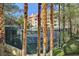 Tennis courts surrounded by trees and a fence at 260 E Flamingo Rd # 433, Las Vegas, NV 89169