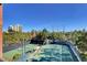 An elevated view of the community tennis courts, showcasing their proximity to residential buildings at 260 E Flamingo Rd # 433, Las Vegas, NV 89169